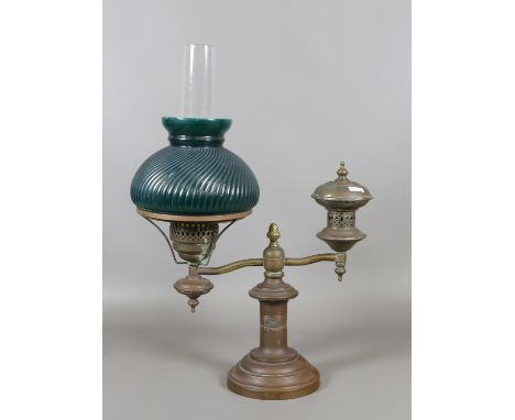 A students continental brass based lamp with green glass shade.