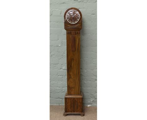 An Art Deco grandmother longcase clock the Westminster chiming movement with three winding holes.