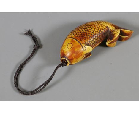 A Japanese Netsuke in the form of a fish.