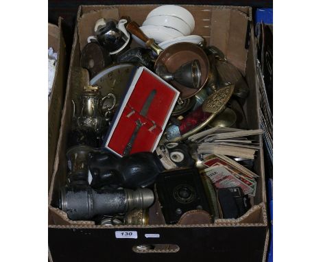 A box of brass and metalware to include horse brasses, door knocker, bell, scabbard, garlic press etc. along with After V. Ro