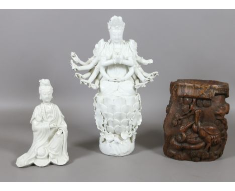 A Chinese blanc de chine figure of a Buddhistic deity and similar figure of Guanyin seated along with a 19th century carved h