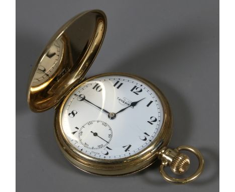 A 9ct gold cased full hunter pocket watch with enamel dial having subsidiary seconds signed Tavannes.