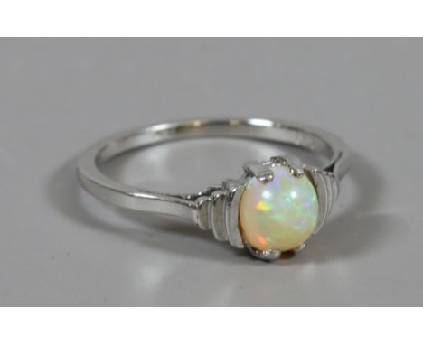 An Art Deco style 9ct white gold ring set with a single opal, size M. 