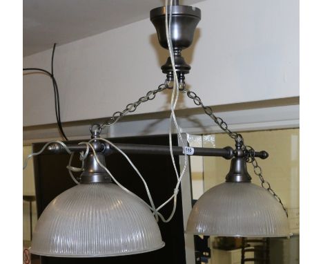 A two branch over table ceiling light fitting with ribbed glass shades.