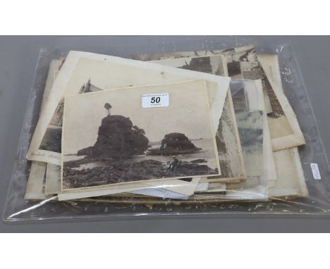 A portfolio of mixed vintage monochrome photographs including topographical landscapes and portraits.