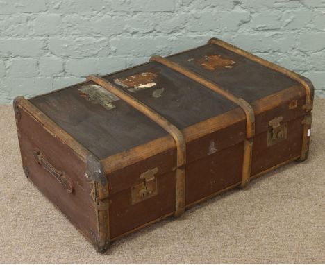 A metal bound travel trunk.