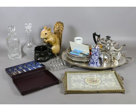 A selection of silver plated items and cut glass decanters along with a ceramic squirrel and various hat pins.