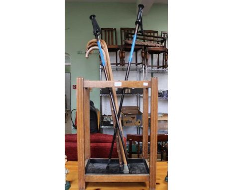 A stick stand with a selection of walking sticks.&nbsp;