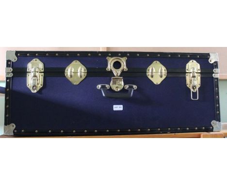 A blue cabin trunk