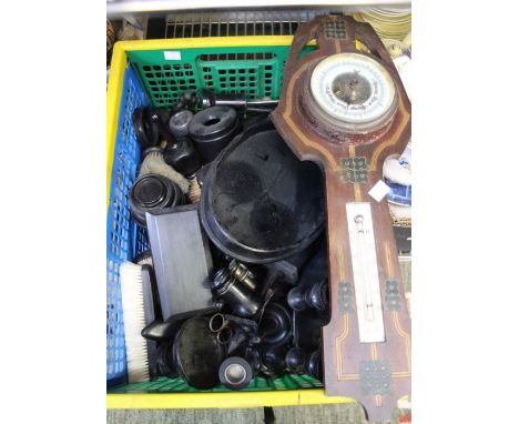 A crate of woodenwares many ebony items and a barometer.