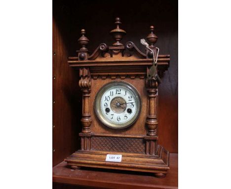 Edwardian carved walnut German mantel clock.