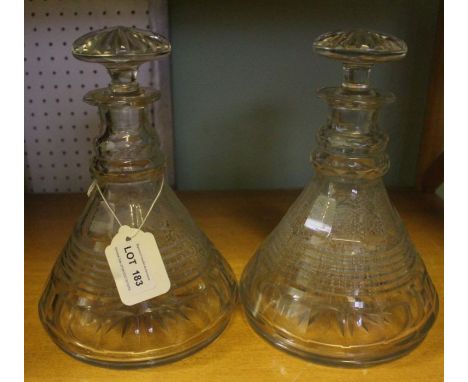 A pair of early 19th century semi ships decanters, with step &amp; slice cutting together with mushroom stoppers
