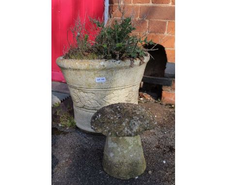 A cast concrete garden planter and a miniature stadle stone.