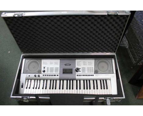 Yamaha keyboard model PSR - E403 in flight case with a folding stand.