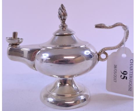 A silver oil lamp, with a serpent handle, marks rubbed, approx. 2.6 ozt, 9 cm high