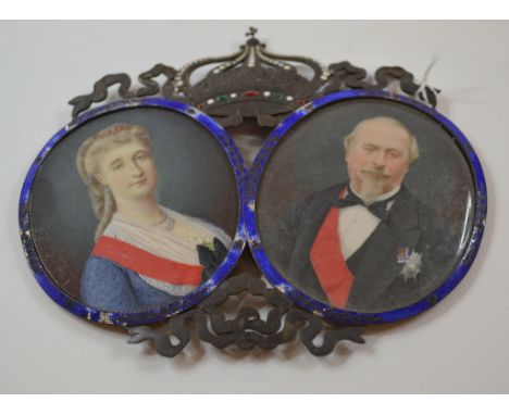 A pair of oval bust portrait miniatures, of Napoleon III and Empress Eugenie, in a frame surmounted a crown, and with enamel 