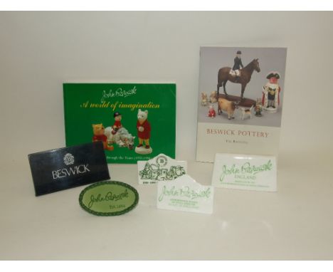 Assorted Beswick and related literature, Beswick and other stands, and Beswick shop display plaques (3 boxes)