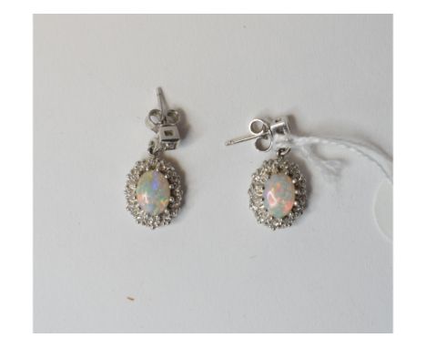 A pair of opal and diamond drop earrings