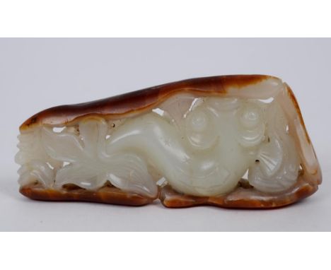 A Chinese white and russet jade carving, in the form of a catfish, 8 cm long  See illustration   Condition report  Report by 