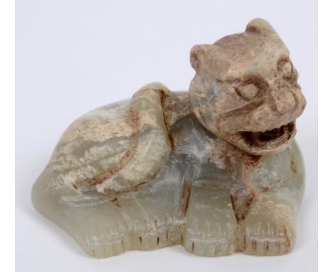 A Chinese carved jade tiger, 5 cm long  See illustration