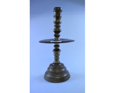 A Dutch style brass candlestick, 29 cm high