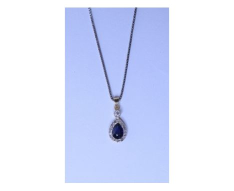 A diamond and sapphire pendant, on a 15ct white gold chain