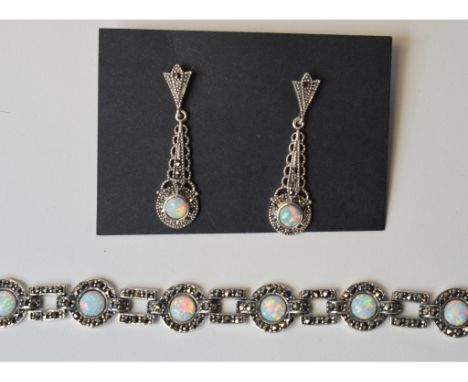 A silver coloured metal, Gilson opal and marcasite bracelet, and a pair of matching drop earrings (2)    Condition report  Mo