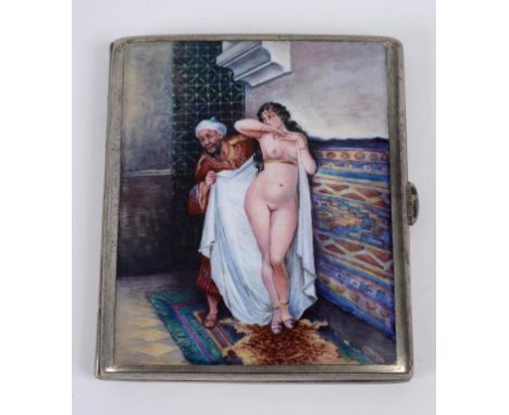A silver plated and enamel cigarette case, the exterior decorated a Moroccan type scene, with an attendant wrapping a nude la