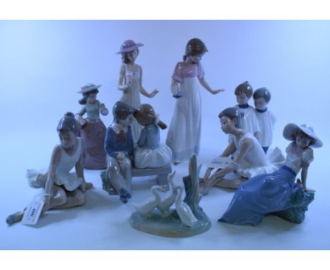 A Nao group, of a boy and girl seated on a bench, 16.5 cm high, and eight similar figures (9)