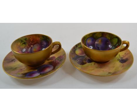 A pair of small Royal Worcester cabinet cups and saucers, painted fruit, puce marks, and other ceramics (damages)