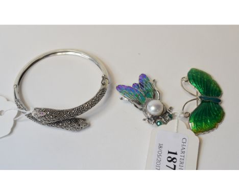 A silver coloured metal and enamel butterfly brooch, and another similar brooch (2)    Condition report  Modern