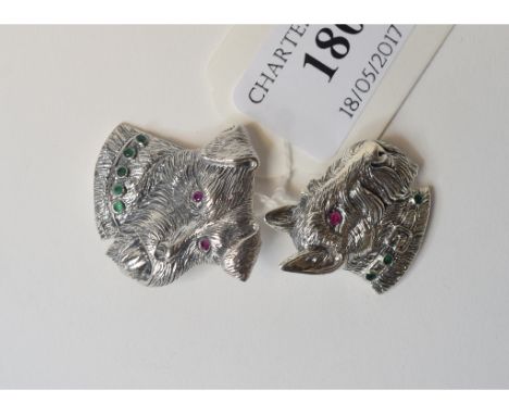 A silver coloured metal Scottie dog brooch, set ruby and emerald, and another similar (2)    Condition report  Modern