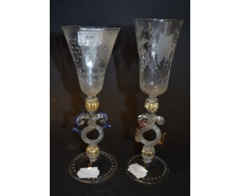 A Murano wine glass, the bowl etched grapes and vine leaves, on a coloured and twisted glass stem, 21.5 cm high, and another 