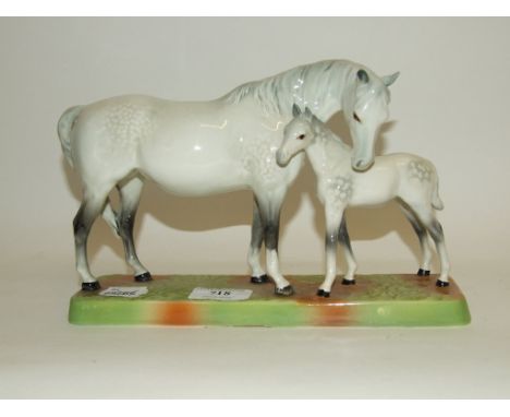 A Beswick Mare and Foal on ceramic base, grey, 1811, gloss (mare with one ear restored)