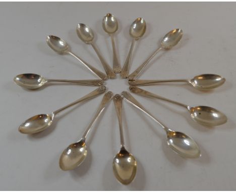 A set of twelve silver coffee spoons, with golfing finials, mostly Sheffield 1933, four modern silver decanter labels, other 