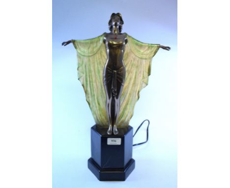 An Art Deco style lamp, in the form of a lady holding a shawl, on a stand, 45 cm high    Condition report  Modern