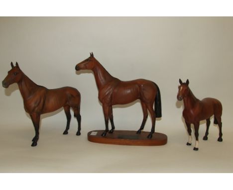 A Beswick Connoisseur Racehorse, Red Rum, 2510, another, Arkle, 2065, with associated base, and another horse, The Winner, br