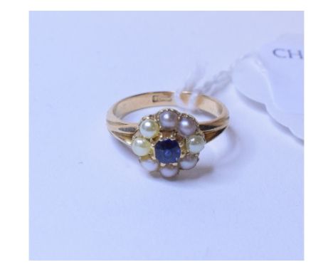 A late Victorian yellow coloured metal, sapphire and seed pearl flower head cluster ring, approx. ring size L