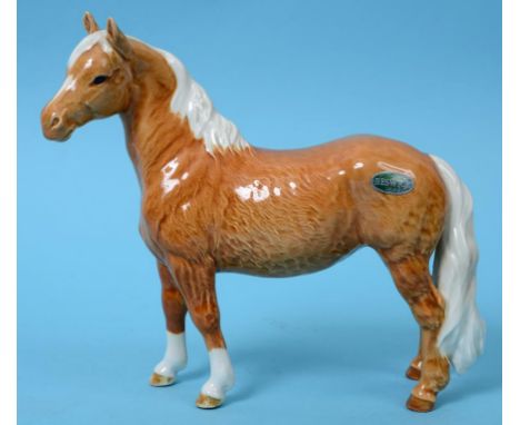 A Beswick Pinto Pony, 1st version, palomino, 1373, gloss (one leg restored)  See illustration