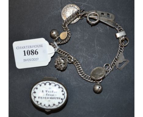 A silver charm bracelet, Birmingham 1905, an enamel box and cover, the lid titled A Trifle from Teignmouth, and other items (