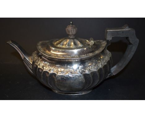 A silver teapot, decorated foliage, Sheffield 1892, approx. 17.7 ozt (all in)