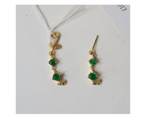 A pair of yellow coloured metal, emerald and diamond drop earrings