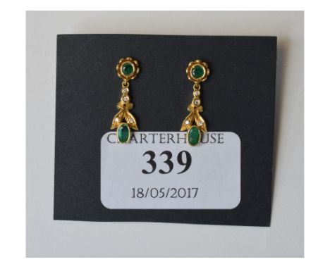 A pair of emerald and diamond drop earrings, in yellow coloured metal settings