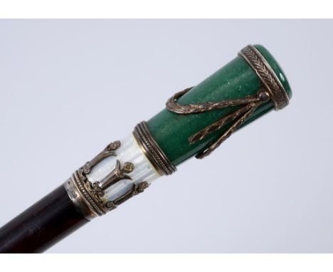 A parasol, with a tortoiseshell, silver coloured metal, enamel and hardstone mounted handle, 82 cm long  See illustration   C