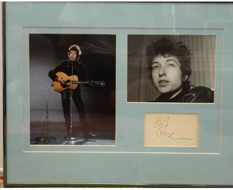 BOB DYLAN. A mounted and framed display to include two images of Bob Dylan and an exceptionally clean 11.5 x 8cm page from an