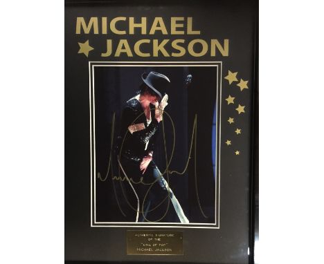 MICHAEL JACKSON SIGNED FRAMED PICTURE. A mounted and framed display to include an 8x10 photographic print of Michael Jackson 