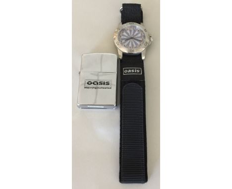OASIS WATCH AND LIGHTER. Two pieces of Oasis memorabilia to include: an Oasis 'Stop The Clocks' watch and a 'Stop Crying Your