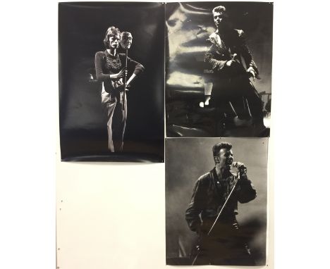 DAVID BOWIE SIGNED PHOTOGRAPHS. To include three large photographic prints of David Bowie in performance. To include 2 x 16x2