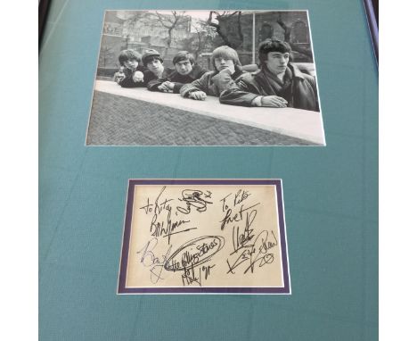 ROLLING STONES FULL GROUP AUTOGRAPHS. A mounted and framed display to include a 14x10cm page from an autograph book and a 25x