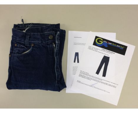 MICHAEL JACKSON OWNED AND WORN JEANS. A pair of men's blue denim jeans size 26/34, owned and worn by Michael Jackson. To be s
